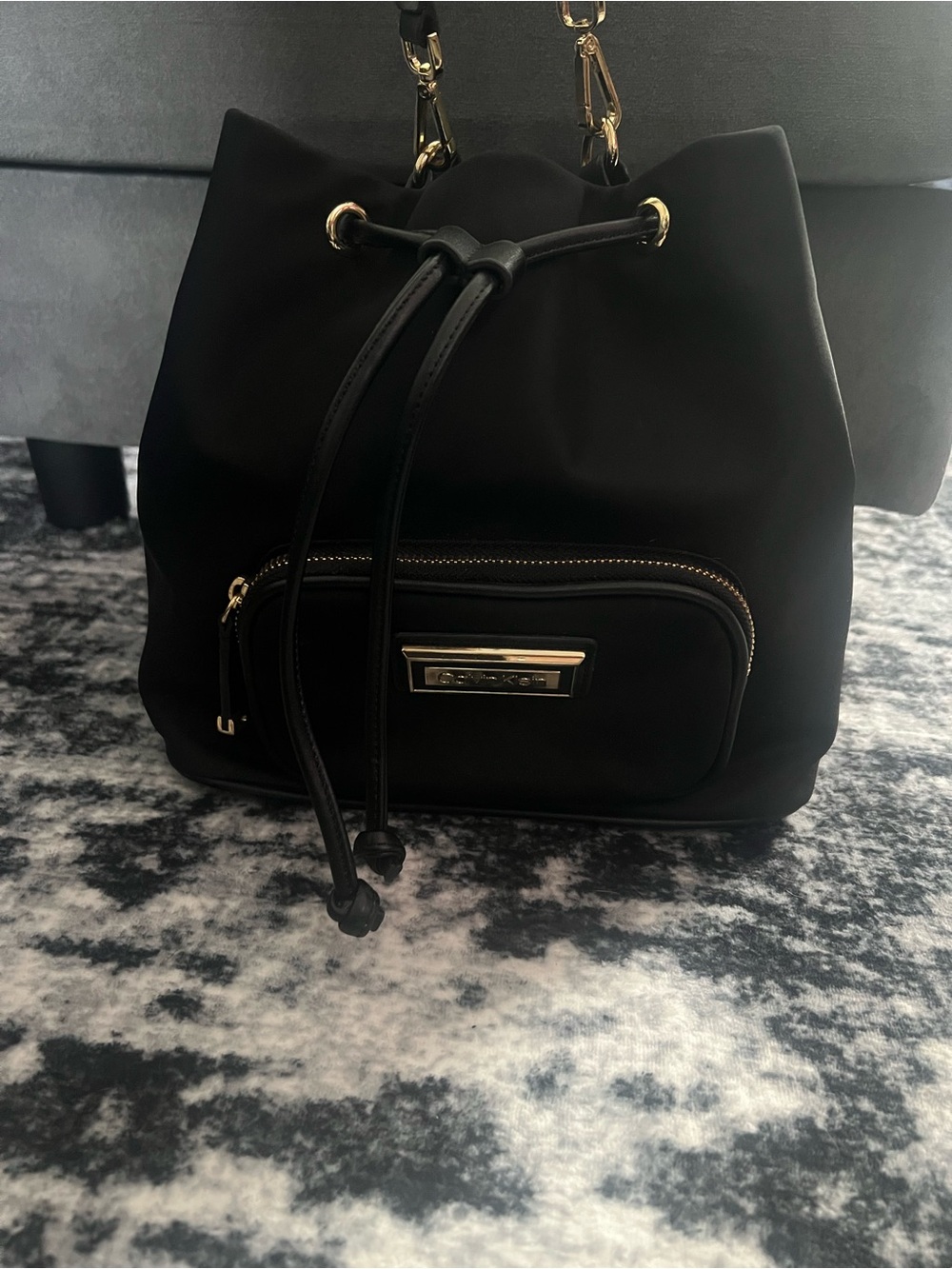 Calvin Klein Black Drawstring Crossbody Bag with Gold Hardware